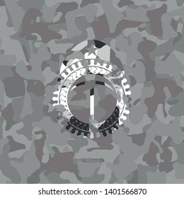 pickaxe icon inside grey camo emblem
