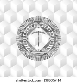 pickaxe icon inside grey emblem with geometric cube white background