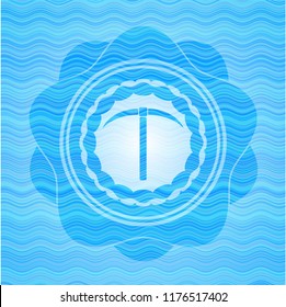 pickaxe icon inside light blue water style emblem.