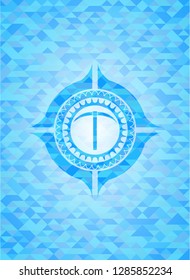 pickaxe icon inside light blue emblem with triangle mosaic background