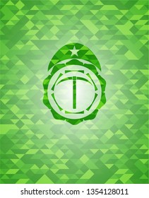 pickaxe icon inside realistic green emblem. Mosaic background
