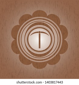 pickaxe icon inside retro wooden emblem