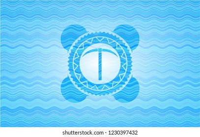 pickaxe icon inside water wave concept badge.