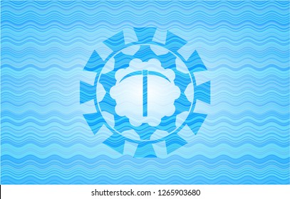 pickaxe icon inside water wave emblem.