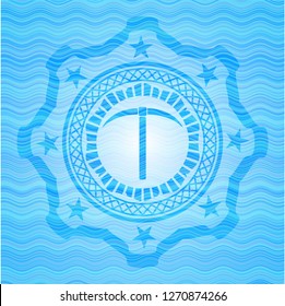 pickaxe icon inside water wave representation style emblem.