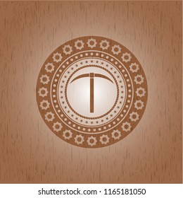 pickaxe icon inside wooden emblem