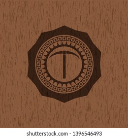 pickaxe icon inside wooden emblem. Vintage.