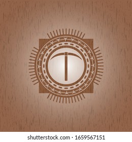 pickaxe icon inside wooden emblem. Retro