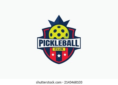 pickleball club logo with a ball, crown, shield, stars, and ribbon.