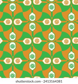 Pickleball paddles on green and orange scallop shapes seamless pattern. For textile, fabric and wrapping paper. 