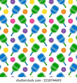 Pickleball. Pattern with green and blue rackets and color balls on a white background 