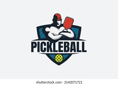 pickleball player logo with a combination of a player or coach holding paddle, ball and shield.