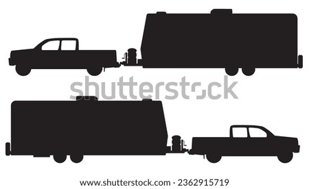 A pickup is hooked up to a camp trailer in silhouette
