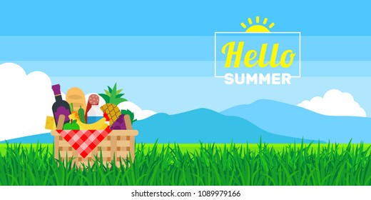 picnic basket with products food on grass summer landscape