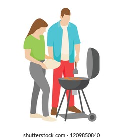 
A picnic couple making bbq food 
