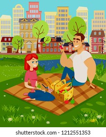 Picnic outside the city. A man and a woman are sitting on the grass, in front of them there is a basket of food. Vector illustration in cartoon style.