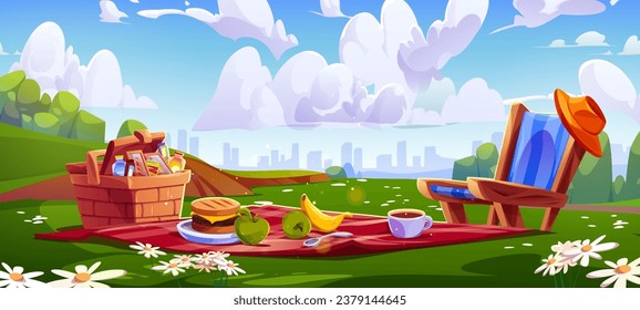 Picnic setup with food on red blanket and in wicker basket at city park over skyline of multistory buildings and clouds. Snacks and hamburger, cup of coffee and fruits on mat, lounge chair with hat.