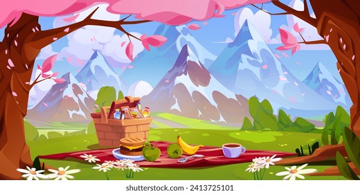 Picnic setup with snacks and fruits on red blanket and in wicker basket on green grass under pink cherry or sakura flowering trees near rocky mountains foot. Cartoon spring scene with outdoor lunch.