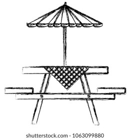 picnic table with umbrella and tableclothes