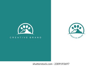 pictogram logo style combination mountain and paw print in green color