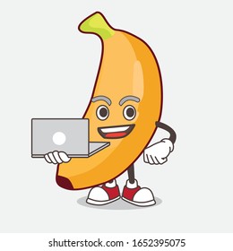 A picture of banana cartoon mascot character working with laptop