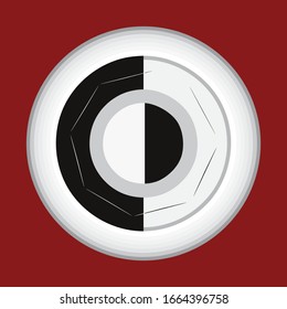 Picture of a black and white, round shape,abstract button, having in reddish background.