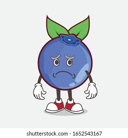 A picture of blueberry cartoon mascot character having an afraid face