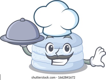 A picture of blueberry macaron as a Chef serving food on tray