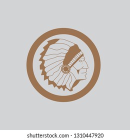 In the picture in the circle the head of the Indian. Indian in a circle, drawing is light brown. Drawing for printing, emblem, banner.