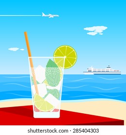 picture of a cocktail standing on table in front of seaside