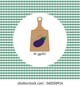 Picture of fruit and vegetables on the cutting board. The eggplant.