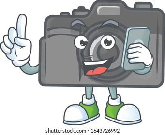 A picture of happy digital camera speaking on the phone