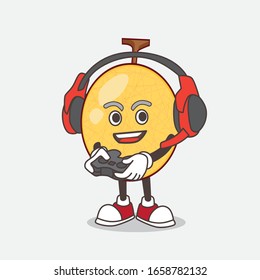 A picture of honeydew melon cartoon mascot character play a game with headphone and controller