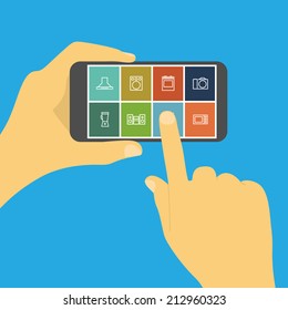 picture of human hand holding mobile phone with household appliances icons, online shopping, e-commerce concept