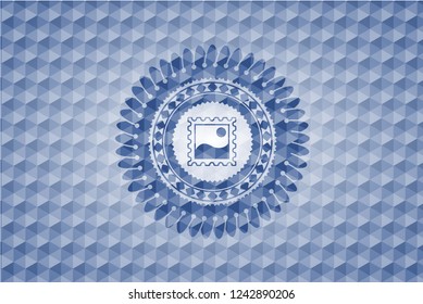 picture icon inside blue emblem or badge with geometric pattern background.