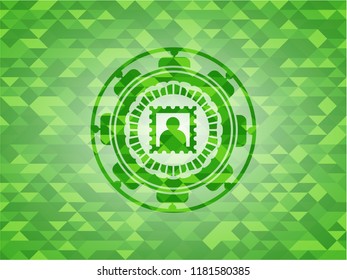 picture icon inside green emblem with mosaic background