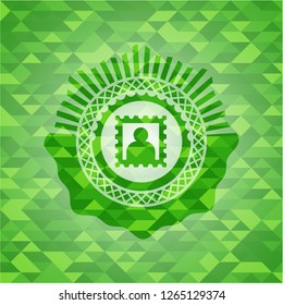 picture icon inside green emblem with triangle mosaic background