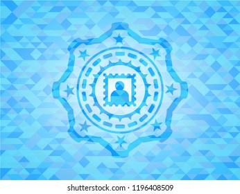picture icon inside light blue mosaic emblem