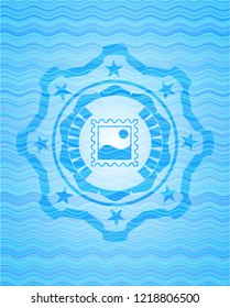 picture icon inside light blue water emblem background.
