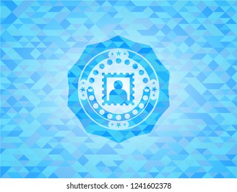 picture icon inside light blue emblem with triangle mosaic background