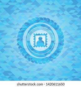 picture icon inside light blue emblem with mosaic ecological style background