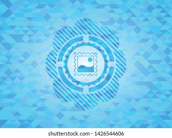 picture icon inside light blue mosaic emblem