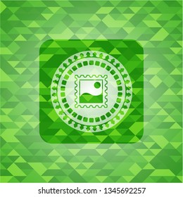 picture icon inside realistic green emblem. Mosaic background