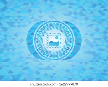 picture icon inside realistic light blue mosaic emblem