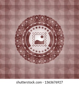 picture icon inside red seamless emblem or badge with geometric pattern background.