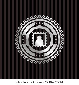 picture icon inside silver emblem. 