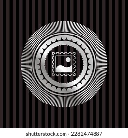 picture icon inside silver emblem. 