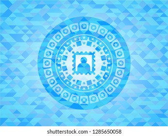 picture icon inside sky blue emblem with triangle mosaic background