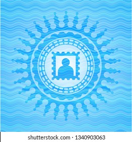picture icon inside sky blue water wave style emblem.