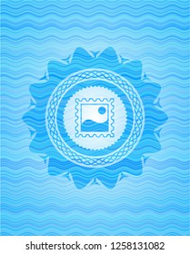 picture icon inside water wave representation emblem.